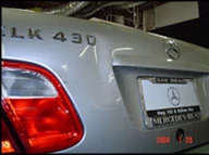 Demonstration of the paintless dent removal process on a Mercedes.