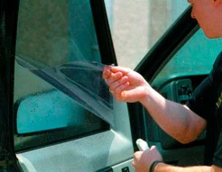 Demonstration of the car window tinting process.
